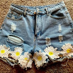 Jean shorts with crochet daisys